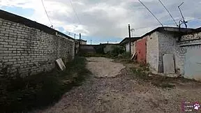 horny student gives blowjob behind garages?