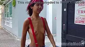 Topless in suspenders micro skirt in public 😏