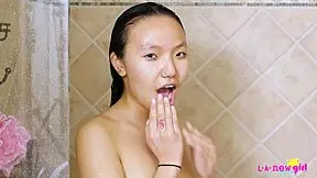 Sexy asian teen enjoys a refreshing shower session