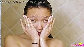 Sexy asian teen enjoys a refreshing shower session