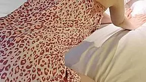 Young brunette in flower print camisole one piece