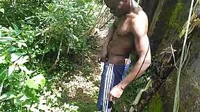 young couple enjoys oiled sex in garden