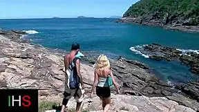 blonde girl enjoys group activity at the seaside