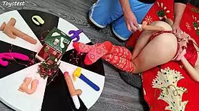 in this double penetration scene at christmas, two thrusting dildos destroy her tight pussy