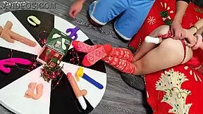 in this double penetration scene at christmas, two thrusting dildos destroy her tight pussy