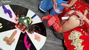 in this double penetration scene at christmas, two thrusting dildos destroy her tight pussy