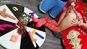 in this double penetration scene at christmas, two thrusting dildos destroy her tight pussy