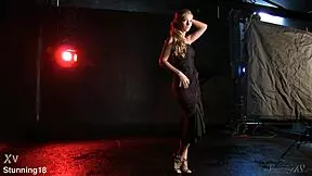 beautiful blond teen model in a black dress