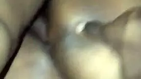 Big ass bounces on young lad's lap outdoors.