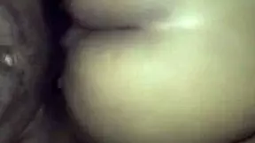 Big ass bounces on young lad's lap outdoors.