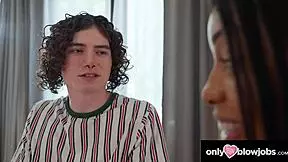 A cute brunette gets tittyfucked and slurps on a huge dick