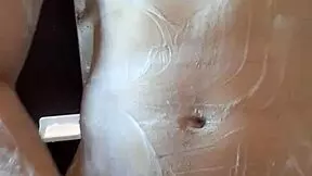 muscular handsome guy enjoys his shower time