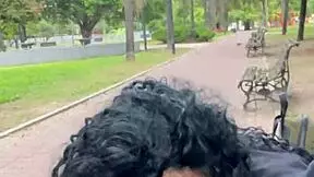 drinking cum in a busy buenos aires park during daylight