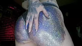young european woman gets a big butt oil massage with colourful glitters