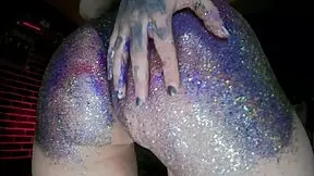 young european woman gets a big butt oil massage with colourful glitters