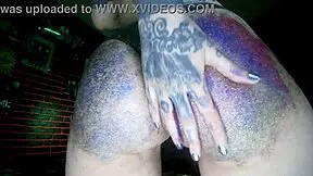 young european woman gets a big butt oil massage with colourful glitters
