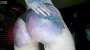 young european woman gets a big butt oil massage with colourful glitters