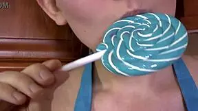 Brunette Sucks On A Lollipop In High Heels?