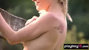 Hungarian blonde Mikki Galante reveals fresh shaved pussy on floral meadow