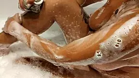 tanned big tits stepsister in bathroom playing with pussy and tits