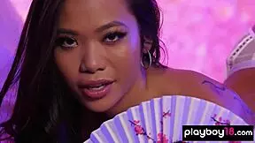 Vina Sky, the petite Asian teen, unveils her smooth shaved pussy.