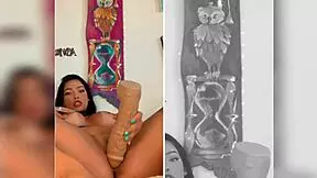 An oriental VIP indulges in intense masturbation with a massive dildo, her body trembling in pleasure.