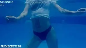 Ashley Rose spreads wet pussy by the pool.