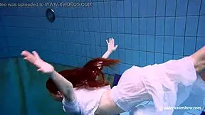 Redhead Marketa Wears A White Dress In The Pool