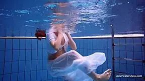 Redhead Marketa Wears A White Dress In The Pool