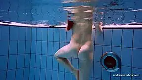 Redhead Marketa Wears A White Dress In The Pool