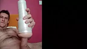 A pretty boy uses a toy to achieve orgasm in his dorm room