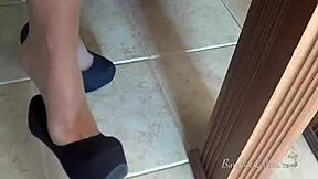 petite milf teases with feet dangling in office heels and pantyhose