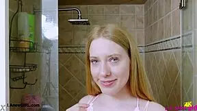 Bright-Eyed Blonde Takes Refreshing Shower Bath