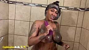 sexy thick cuban shows off her tattoos then gets fucked in the shower doggy style