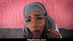 cute hijab teen learns new skills with shy guidance