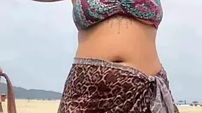 young african girl gets naked on beach and teases guy