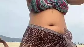 young african girl gets naked on beach and teases guy