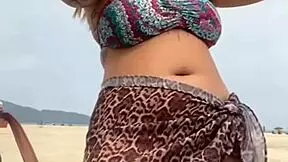 young african girl gets naked on beach and teases guy