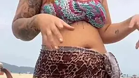 young african girl gets naked on beach and teases guy