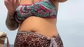 young african girl gets naked on beach and teases guy