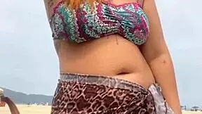 young african girl gets naked on beach and teases guy