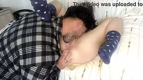 Half sister passionately interacts with brother on sofa.