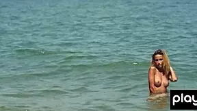 cara mell says, 'nude posing on the sand'