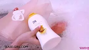 Enchanting brunette muse enjoys a sensual bath