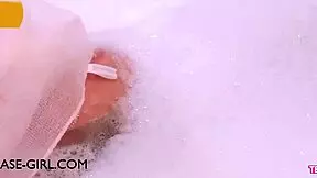 Enchanting brunette muse enjoys a sensual bath