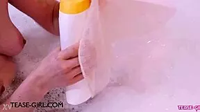 Enchanting brunette muse enjoys a sensual bath