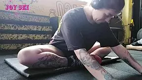 alternative girl stretching at the gym