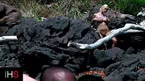 Amazing girl fucks black man on beach while another watches