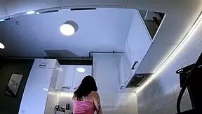 Redhead cheerleader shows panties in kitchen