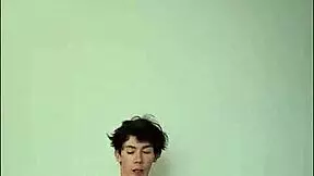 Horny young girl masturbating with big cock on bed.